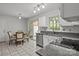 Eat-in kitchen with table, sliding glass doors to outside, white cabinets, and granite countertops at 150 Pleasant Grove Ln, Mooresville, NC 28115