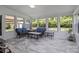 Bright sun room with lots of windows and neutral decor at 150 Pleasant Grove Ln, Mooresville, NC 28115