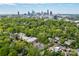 Sweeping aerial view of the city skyline framed by lush greenery and suburban homes at 1517 Waverly Ave, Charlotte, NC 28203