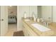 Bathroom with double sink vanity, granite countertops, and access to an adjacent bedroom at 1517 Waverly Ave, Charlotte, NC 28203