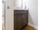 Stylish bathroom featuring dark wood cabinets with granite countertops and modern fixtures at 1517 Waverly Ave, Charlotte, NC 28203
