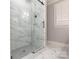 Modern walk-in shower featuring glass enclosure, tiled walls and floors at 1517 Waverly Ave, Charlotte, NC 28203