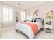 Light-filled bedroom with shutters, neutral walls, carpet, and whimsical decor at 1517 Waverly Ave, Charlotte, NC 28203