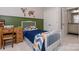 Well-lit bedroom features stylish decor, complemented by an adjacent bathroom and ample closet space at 1517 Waverly Ave, Charlotte, NC 28203