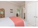 Bedroom featuring neutral walls and carpet with a view into an office space and bathroom at 1517 Waverly Ave, Charlotte, NC 28203