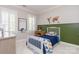 Bright bedroom featuring shutters, neutral walls, carpet, and whimsical decor at 1517 Waverly Ave, Charlotte, NC 28203