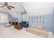 Spacious bonus room with sloped ceilings, blue walls, large windows with plantation shutters and neutral carpet at 1517 Waverly Ave, Charlotte, NC 28203