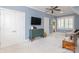 Large bonus room with a ceiling fan, sloped ceilings, blue walls, neutral carpet, and storage at 1517 Waverly Ave, Charlotte, NC 28203