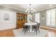Elegant dining room with wood floors, a classic hutch, and wainscoting perfect for Gathering gatherings at 1517 Waverly Ave, Charlotte, NC 28203