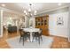 Elegant dining room with wood floors, a classic hutch, and wainscoting perfect for Gathering gatherings at 1517 Waverly Ave, Charlotte, NC 28203