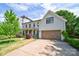 Two-story home with a front lawn, a two-car garage, and traditional architecture at 1517 Waverly Ave, Charlotte, NC 28203