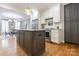 Beautiful kitchen featuring stainless steel appliances, granite countertops, an island, and hardwood flooring at 1517 Waverly Ave, Charlotte, NC 28203