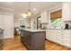 Beautiful kitchen featuring stainless steel appliances, granite countertops, an island, and hardwood flooring at 1517 Waverly Ave, Charlotte, NC 28203