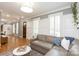 Open-concept living room with ample natural light and a view of the entryway at 1517 Waverly Ave, Charlotte, NC 28203