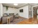 Inviting living room with hardwood floors and comfortable seating with modern television at 1517 Waverly Ave, Charlotte, NC 28203