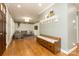 Bright living room with hardwood floors, custom paneling, and modern furnishings at 1517 Waverly Ave, Charlotte, NC 28203