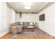 Cozy living room featuring a sectional sofa, decorative rug, and stylish decor at 1517 Waverly Ave, Charlotte, NC 28203