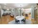 Open-concept living space connecting the dining room, kitchen, and living room ideal for entertaining and Gathering time at 1517 Waverly Ave, Charlotte, NC 28203