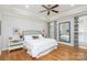 Relaxing bedroom with tray ceiling, ceiling fan, and ample space at 1517 Waverly Ave, Charlotte, NC 28203