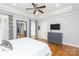 Spacious bedroom featuring tray ceiling, ceiling fan and ample space at 1517 Waverly Ave, Charlotte, NC 28203
