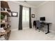 Bright office space with custom shelving and a large window, perfect for productivity at 1517 Waverly Ave, Charlotte, NC 28203