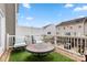 Back deck with outdoor seating, artificial turf, and a view of the neighborhood at 15746 Marvin Rd, Charlotte, NC 28277