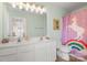 Bright bathroom features a unicorn shower curtain and a double sink vanity at 15746 Marvin Rd, Charlotte, NC 28277