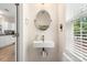Stylish half bathroom features a modern sink and fixtures with natural light at 15746 Marvin Rd, Charlotte, NC 28277