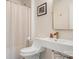 Modern half bath with a floating sink, sleek fixtures, and neutral decor at 15746 Marvin Rd, Charlotte, NC 28277
