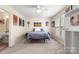 Comfortable bedroom with lots of sunlight and additional access to ensuite bathroom at 15746 Marvin Rd, Charlotte, NC 28277