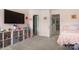 Charming pink bedroom with storage shelves and two access doors for convenience at 15746 Marvin Rd, Charlotte, NC 28277