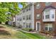 Townhome front exterior showcasing a mix of siding and brick, with manicured landscaping at 15746 Marvin Rd, Charlotte, NC 28277