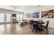 Spacious living room featuring hardwood floors, an eating nook, and a comfortable sofa at 15746 Marvin Rd, Charlotte, NC 28277