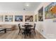 Open-concept living room and dining area with hardwood floors, tasteful decor, and a comfortable atmosphere at 15746 Marvin Rd, Charlotte, NC 28277