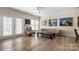 Bright living room with hardwood floors and French door access at 15746 Marvin Rd, Charlotte, NC 28277