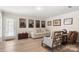 Bright living room boasts hardwood floors and stylish decor at 15746 Marvin Rd, Charlotte, NC 28277
