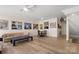 Open-concept living area with hardwood floors and modern lighting at 15746 Marvin Rd, Charlotte, NC 28277