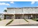 View of the rear of the townhomes with decks and driveways for parking at 15746 Marvin Rd, Charlotte, NC 28277