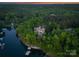 Gorgeous waterfront estate surrounded by lush greenery, offering privacy and scenic views of the lake at 172 Tennessee Cir, Mooresville, NC 28117