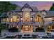 Stunning backyard featuring a stone facade, balcony, covered seating area, and luxurious pool at 172 Tennessee Cir, Mooresville, NC 28117
