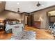 Comfortable bedroom with dark trim, hardwood floors, a chest of drawers, and a luxurious zebra rug at 172 Tennessee Cir, Mooresville, NC 28117