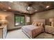 This bedroom boasts a unique textured ceiling, neutral color palette, and tranquil garden view at 172 Tennessee Cir, Mooresville, NC 28117