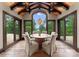 Stunning dining room boasts wood beams, hardwood floors and lovely views of the surrounding landscape at 172 Tennessee Cir, Mooresville, NC 28117