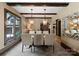 Elegant dining room with large windows, modern lighting, and a stylish dining set for entertaining at 172 Tennessee Cir, Mooresville, NC 28117