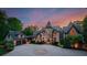 Stately home with stone and stucco facade, circular driveway, and attached garage at 172 Tennessee Cir, Mooresville, NC 28117