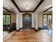 Grand foyer with hardwood floors, elegant lighting, and striking architectural details at 172 Tennessee Cir, Mooresville, NC 28117