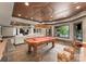 Spacious game room featuring a pool table, lounge area, and ample lighting for entertaining at 172 Tennessee Cir, Mooresville, NC 28117