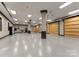 Spacious garage features multiple bays and storage, perfect for car enthusiasts and hobbyists alike at 172 Tennessee Cir, Mooresville, NC 28117