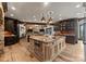 Gourmet kitchen with a large island, stainless steel appliances, and custom cabinetry at 172 Tennessee Cir, Mooresville, NC 28117