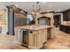 Well-appointed kitchen featuring a center island, wine cooler, and stainless steel refrigerator at 172 Tennessee Cir, Mooresville, NC 28117
